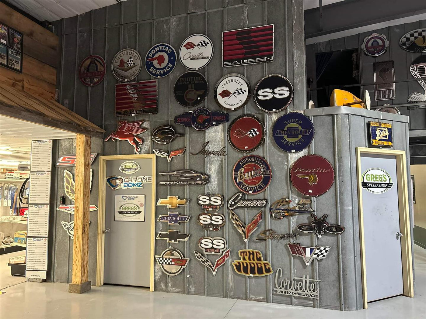 Garage of Chrome Domz customer with feature wall of Chrome Domz signs 