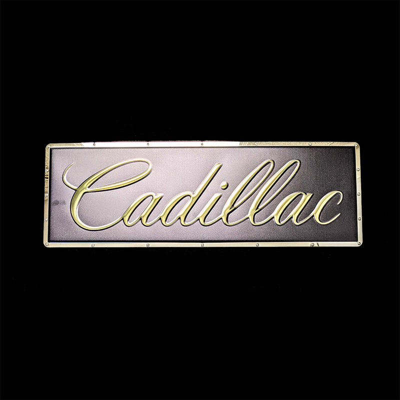 embossed mirror polished stainless steel sign Cadillac script