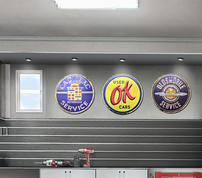 embossed mirror polished stainless steel sign Cadillac service on wall